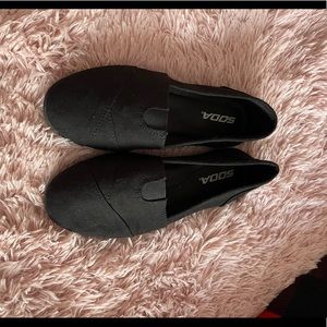 Brand Soda. Black flats.